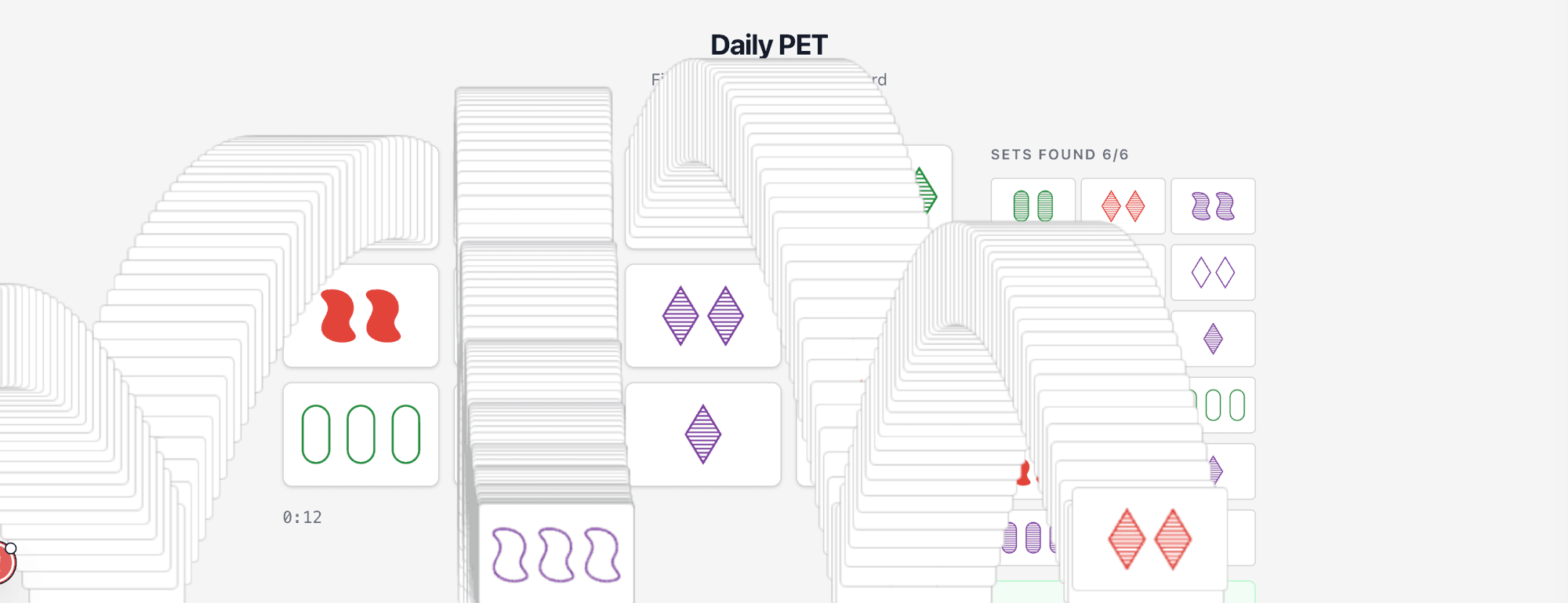 Daily PET — cards cascade across the screen after completing the puzzle